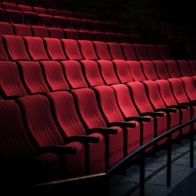 Rows of red seats in a theater